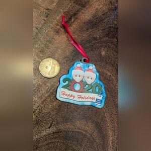 Blue and Red Holiday Ornament with Snowman Design